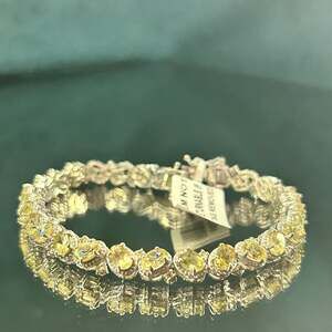 Stylish 31.30 carat yellow apatite and yellow sapphire bracelet